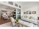 Open-concept home showcasing seamless transition between living room, sunroom, and kitchen areas at 4220 Barletta Ct, Wesley Chapel, FL 33543