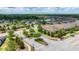 Community street view with well-manicured landscaping, lush trees, and paved walking paths, highlighting the neighborhood's charm at 4220 Barletta Ct, Wesley Chapel, FL 33543