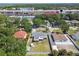 Aerial view of a cozy home in a neighborhood, showcasing the backyard and surrounding greenery at 4610 W Mcelroy Ave, Tampa, FL 33611
