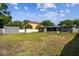 Expansive backyard featuring well-maintained lawn and storage sheds, perfect for outdoor activities at 4610 W Mcelroy Ave, Tampa, FL 33611