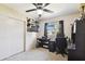 Comfortable bedroom featuring carpet floors, a ceiling fan, and a bright window at 4610 W Mcelroy Ave, Tampa, FL 33611