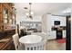 Open dining space with a view of the living area, and bright kitchen area at 4610 W Mcelroy Ave, Tampa, FL 33611