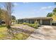Inviting single-story home with a freshly landscaped front yard and a convenient attached garage at 4610 W Mcelroy Ave, Tampa, FL 33611