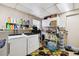 Functional laundry room with washer, dryer, and ample storage space for household essentials at 4610 W Mcelroy Ave, Tampa, FL 33611