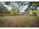 Spacious backyard features a patio with outdoor seating, and a secure wooden fence, offering a private outdoor living space at 4803 Highland, Tampa, FL 33603