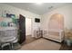 Cozy Bedroom features a white crib, dresser, decorative mural, and a play area at 4803 Highland, Tampa, FL 33603