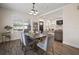 Inviting dining area with modern chandelier, stylish furniture, and natural light at 4803 Highland, Tampa, FL 33603