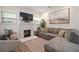 Bright living room with fireplace, modern finishes and a neutral color palette at 4803 Highland, Tampa, FL 33603
