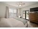 Bright primary bedroom with ceiling fan, french doors, and ample natural light at 4803 Highland, Tampa, FL 33603