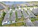 This is an aerial view of a new construction neighborhood with beautiful homes and a lake view at 5068 Little Stream Ln, Wesley Chapel, FL 33545