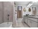 Bathroom featuring a shower/tub combo and neutral-toned decor at 5068 Little Stream Ln, Wesley Chapel, FL 33545