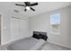 Cozy bedroom featuring carpet, a ceiling fan, a closet, and a window at 5068 Little Stream Ln, Wesley Chapel, FL 33545