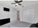 Carpeted bedroom with neutral walls and large closet at 5068 Little Stream Ln, Wesley Chapel, FL 33545