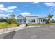 Attractive community clubhouse exterior with a stylish design and manicured landscaping at 5068 Little Stream Ln, Wesley Chapel, FL 33545