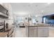 Open concept kitchen looking into the dining and living room area at 5068 Little Stream Ln, Wesley Chapel, FL 33545