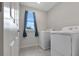 Laundry room with included washer and dryer near a window at 5068 Little Stream Ln, Wesley Chapel, FL 33545