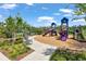 Community playground with colorful slides and equipment for Gathering fun and recreation at 5068 Little Stream Ln, Wesley Chapel, FL 33545