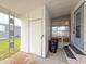 Covered entrance area with storage and access to the interior of the home at 5150 Damsen Cir, New Port Richey, FL 34653