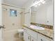 Clean bathroom featuring a granite-topped vanity, a sink, and a bathtub-shower combo at 5245 3Rd N Ave, St Petersburg, FL 33710