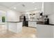 Functional kitchen with white cabinets, stainless steel appliances, and breakfast bar at 5245 3Rd N Ave, St Petersburg, FL 33710