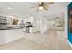 Bright and open living area with tile flooring and an adjacent kitchen at 5245 3Rd N Ave, St Petersburg, FL 33710