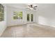 Bright sun room with tile flooring, large windows, and glass patio doors to backyard at 5245 3Rd N Ave, St Petersburg, FL 33710
