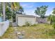 The backyard contains a chainlink fence, white picket fence, detached structure, and stepping stones at 536 Braddock S St, St Petersburg, FL 33707