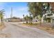 View down the long driveway to the fenced backyard with detached shed at 536 Braddock S St, St Petersburg, FL 33707