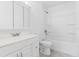 Bathroom featuring a vanity, toilet, and a shower-tub combo with white fixtures at 536 Braddock S St, St Petersburg, FL 33707