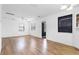 Bright living room featuring wood-look flooring, white walls, and lots of natural light at 536 Braddock S St, St Petersburg, FL 33707