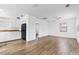 Open-concept living and dining room with bright white walls and modern wood-look flooring at 536 Braddock S St, St Petersburg, FL 33707