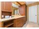 Bathroom with a marble countertop, wood cabinets, and storage at 5729 Puerta Del Sol S Blvd # 185, St Petersburg, FL 33715