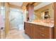 Bathroom boasting a marble countertop, wood cabinets and glass shower at 5729 Puerta Del Sol S Blvd # 185, St Petersburg, FL 33715