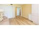 Bedroom featuring a closet, modern built in storage and wood flooring at 5729 Puerta Del Sol S Blvd # 185, St Petersburg, FL 33715