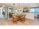Dining area featuring modern decor, wood floors, and access to a view into the kitchen at 5729 Puerta Del Sol S Blvd # 185, St Petersburg, FL 33715