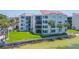 Beautiful beachfront condo featuring a well-maintained lawn and a private balcony with water views at 5729 Puerta Del Sol S Blvd # 185, St Petersburg, FL 33715