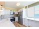 Modern kitchen with stainless steel appliances and a bright window at 5729 Puerta Del Sol S Blvd # 185, St Petersburg, FL 33715