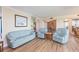 Spacious living area featuring light wood floors, comfortable seating, and lots of natural light at 5729 Puerta Del Sol S Blvd # 185, St Petersburg, FL 33715