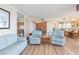 Open concept living and dining area with light wood floors and comfortable seating at 5729 Puerta Del Sol S Blvd # 185, St Petersburg, FL 33715