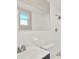 Clean bathroom featuring a shower with chrome fixtures, toilet, and mirrored vanity at 6017 6Th Ave, New Port Richey, FL 34653