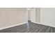 Empty bedroom with gray walls, laminate flooring, closet space, and natural light at 6017 6Th Ave, New Port Richey, FL 34653