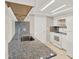 Well-lit kitchen featuring granite countertops, white cabinets, and stainless steel sink at 6017 6Th Ave, New Port Richey, FL 34653