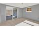 Open living area with sliding glass doors leading to a spacious backyard at 6017 6Th Ave, New Port Richey, FL 34653