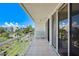 Relax on this tiled balcony with seating, overlooking well-manicured landscaping at 6081 Bahia Del Mar Cir # 452, St Petersburg, FL 33715
