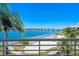 Scenic balcony view showcasing a bridge over calm blue waters with sandy beach at 6081 Bahia Del Mar Cir # 452, St Petersburg, FL 33715