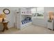 Nautical-themed bedroom with white bunk beds, striped bedding, and beachy decor at 6081 Bahia Del Mar Cir # 452, St Petersburg, FL 33715
