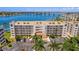 Exterior view of the condo building showcasing its architectural design and parking at 6081 Bahia Del Mar Cir # 452, St Petersburg, FL 33715