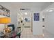 Hallway view with kitchen and bathroom access, nautical decorations, tiled floors at 6081 Bahia Del Mar Cir # 452, St Petersburg, FL 33715