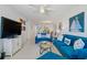 Open-concept living room with comfortable seating, nautical decor, and a glimpse into the dining area at 6081 Bahia Del Mar Cir # 452, St Petersburg, FL 33715