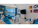 Cozy living room with blue furnishings, nautical decor, and serene waterfront views at 6081 Bahia Del Mar Cir # 452, St Petersburg, FL 33715